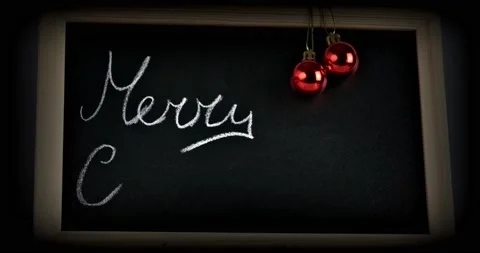 Written Marry Christmas on a chalkboard Stock Footage 144028397