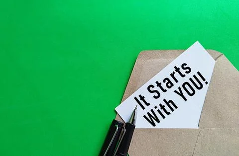 Written note IT STARTS WITH YOU. Self-inspiration shapes personality 库存照片