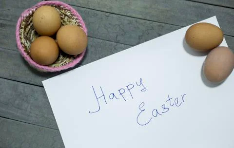 Written the word:happy easter with some eggs. Stock Photos