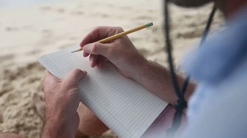 Writting Letter on Beach Stock Footage 72652941