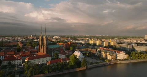 Wrocław Cathedral on Ostrów Tumski in sunlight under storm clouds Stock Footage 346644882