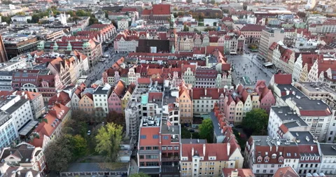 Wrocław Old Town rooftops aerial flyover on an autumn evening Stock Footage 346656495