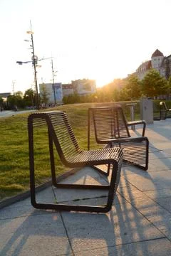 Wroclaw, Poland - June 6, 2015: Iron chairs at main railway station building  Stock Photos