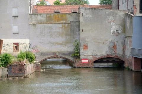 Wroclaw, Poland - June 7, 2015:  Old devastated buildings at Odra river canal Stock Photos