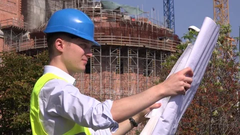 Wrong building execution angry upset architect supervising site read blueprints Stock Footage
