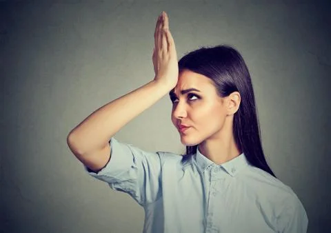 Wrong doing. Closeup portrait upset woman, slapping hand on head having duh.. Stock Photos