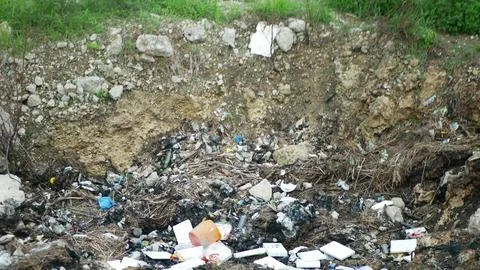 Wrong garbage hole composting Philippines, unmanaged waste Stock Photos