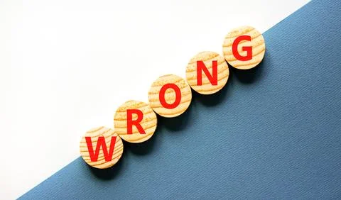 Wrong symbol. Concept word Wrong on beautiful wooden circles. Beautiful white Stock Photos