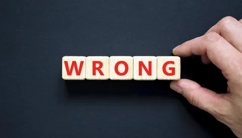 Wrong symbol. Concept word Wrong on beautiful wooden blocks. Beautiful blac.. Stock Photos