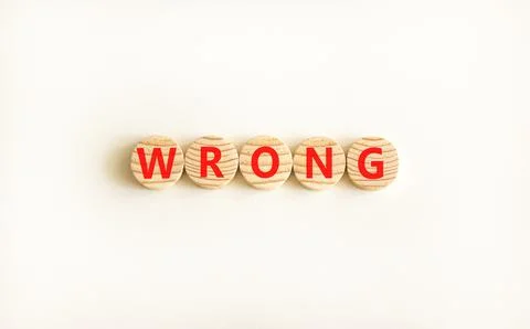 Wrong symbol. Concept word Wrong on beautiful wooden circles. Beautiful white Stock Photos