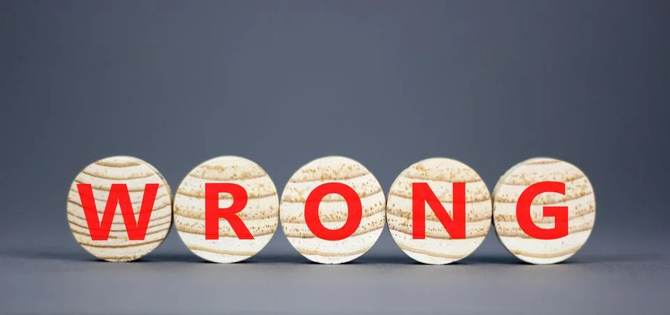 Wrong symbol. Concept word Wrong on beautiful wooden circles. Beautiful grey  Stock Photos
