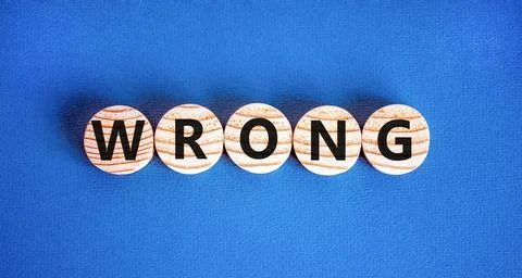 Wrong symbol. Concept word Wrong on beautiful wooden circles. Beautiful blue  Stock Photos