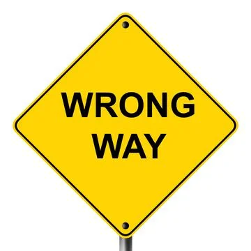 Wrong way caution hazard symbol on yellow road sign Stock Photos