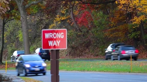 Wrong Way Sign in Fall Traffic Stock Footage 59173288
