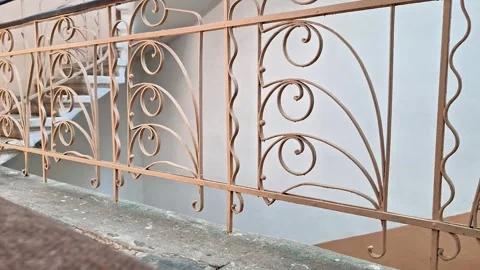 Wrought Iron Staircase Railing Along Indoor Building Landing Stock Footage 336839079