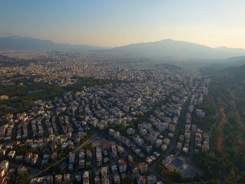 WS AERIAL looking down on grid of Athens city in Greece 스톡 동영상 76854330