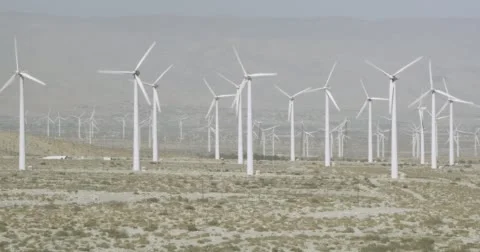 WS AERIAL ZO View of wind turbines in wind farm near mountain Stock Footage 62769063