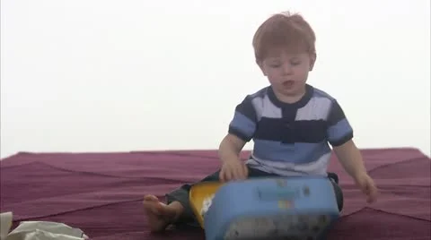 WS Boy (4-5) with pieces of puzzle from bag Stock Footage 11339564