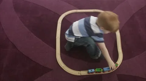 WS Boy (4-5) playing with miniature train Stock Footage 11339584