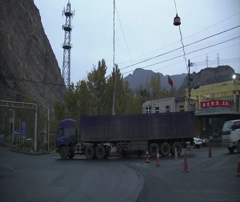 WS coal trucks at intersection with other traffic Stock Footage 86744864