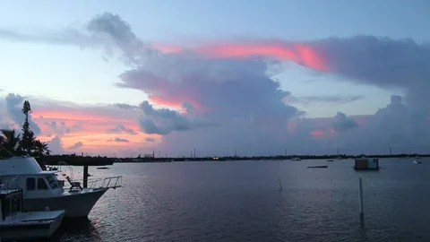 WS Dock boat sunset storm Stock Footage 104739222