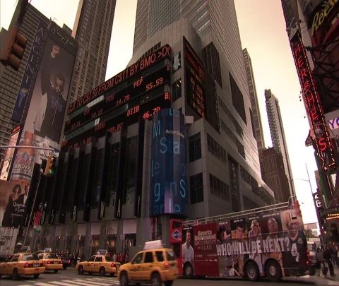 WS of LED ticker and traffic on Broadway, zoom in to blue Morgan Stanley sign. Stock Footage 86749205