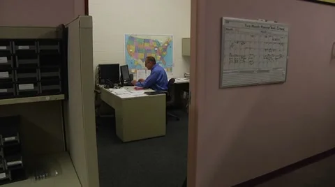 WS man at desk in office Stock Footage 8607995