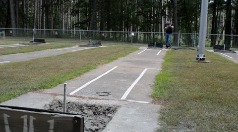 WS Man throwing horseshoe Stock Footage 33517047