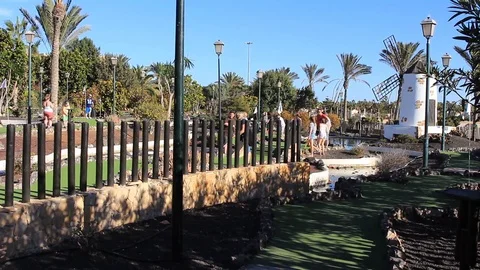 WS mini golf course with windmill next to the beach Stock Footage 85893855