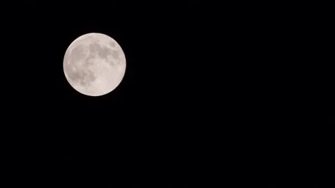 WS Moon against a night sky (left) Stock Footage 137809258