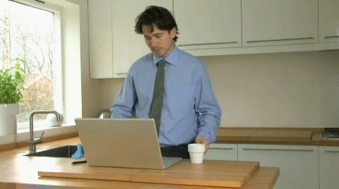 WS PAN OF A MAN USING A LAPTOP Stock Footage 542528