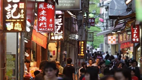 WS People walking down busy street / Macau, China Stock Footage 69951573