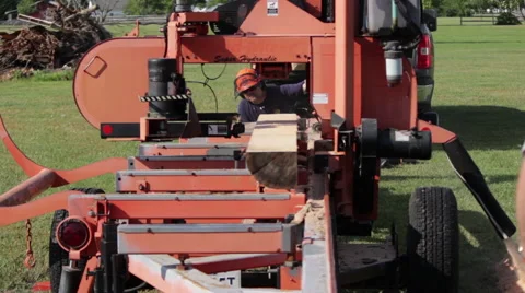 WS Portable sawmill cutting log front shot Stock Footage 40472414