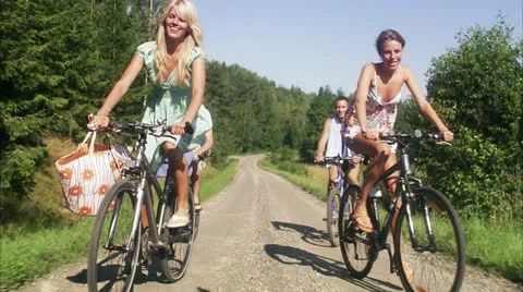 WS REAR POV Friends riding bikes in countryside Stock Footage