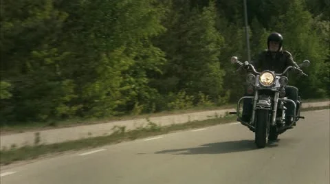 WS REAR POV Senior man riding vintage motorbike Stock Footage