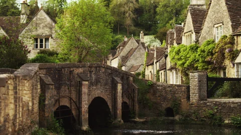 WS Stone bridge in village / Castle Combe, Cotswolds, Wiltshire, UK Stock Footage