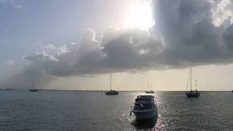 WS Sunshine boats clouds Stock Footage 104739522