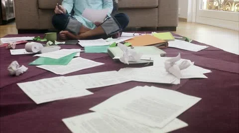 WS TU Mature woman sitting on ground doing paperwork / Stockholm Stock Footage