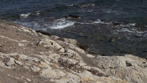 WS - waves lapping around the remains of ancient harbor walls Stock Footage 82260835