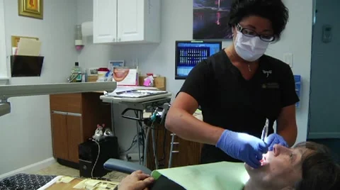 WS woman's teeth being cleaned Stock Footage 8652618