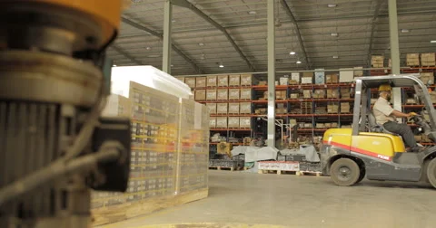 WS Worker Using Forklift to Transport Crate in Battery Factory (4K) Stock Footage 60786623