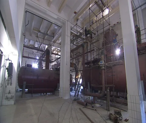 WS workers in hard hats welding inside Shenhua Sanhe power station. Stock Footage 86746032