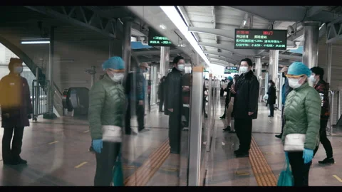Wuhan back to work after coronavirus lockdown, train travel, China slo-mo Stock Footage 132574180