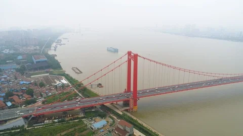 WUHAN, CHINA - MAY 2, 2017: Aerial drone video, red suspension bridge with Stock Footage 86833625