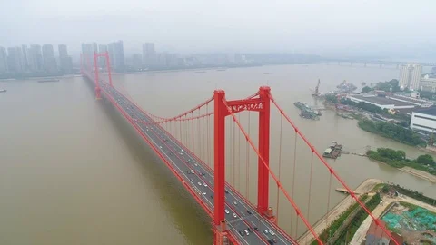 WUHAN, CHINA - MAY 2, 2017: Aerial drone video, red suspension bridge with 스톡 동영상 86834902