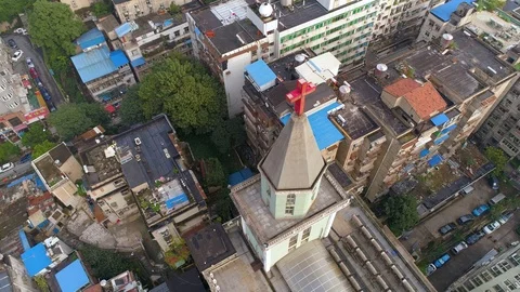WUHAN, CHINA - MAY 2, 2017: aerial drone view of the church buildings around in Stock Footage 86876996