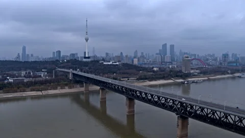 Wuhan city skyline, empty bridge, coronavirus lockdown, China 4K drone Stock Footage 131902553