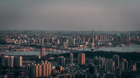 Wuhan city skyline at sunset, Yangtze River, China 4K aerial Stock Footage