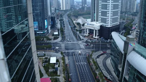 Wuhan cty skyscrapers and empty streets, coronavirus lockdown, 4K aerial Stock Footage