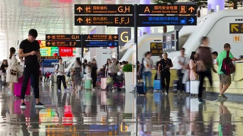 Wuhan day time airport check-in zone crowded panorama 4k timelapse china Stock Footage
